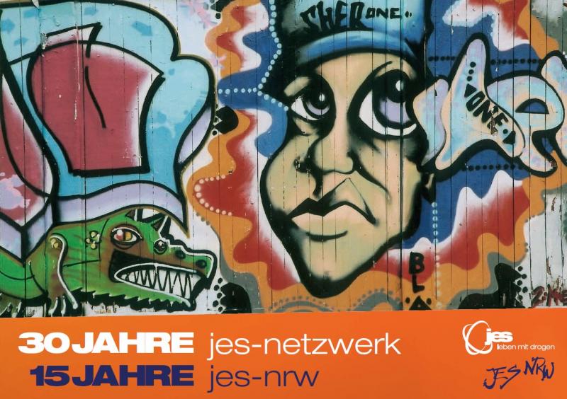 Grafiti von einem Gesicht und einem Krokodil auf einer Hauswand. Titel "30 Jahre JES-Netzwerk, 15 Jahre JES-NRW"